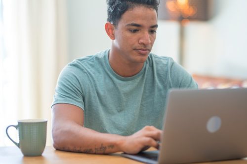 man looking at laptop