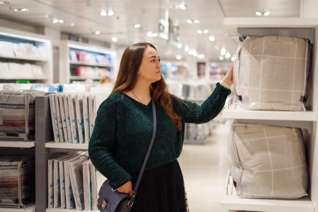 woman shopping for bedding