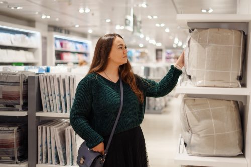 woman shopping for bedding