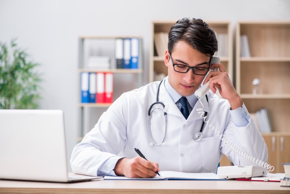 doctor consulting patient on phone