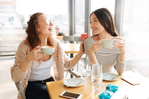 Two Girlfriends Having Coffee