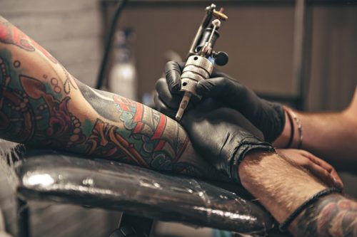 tattoo artist giving tattoo