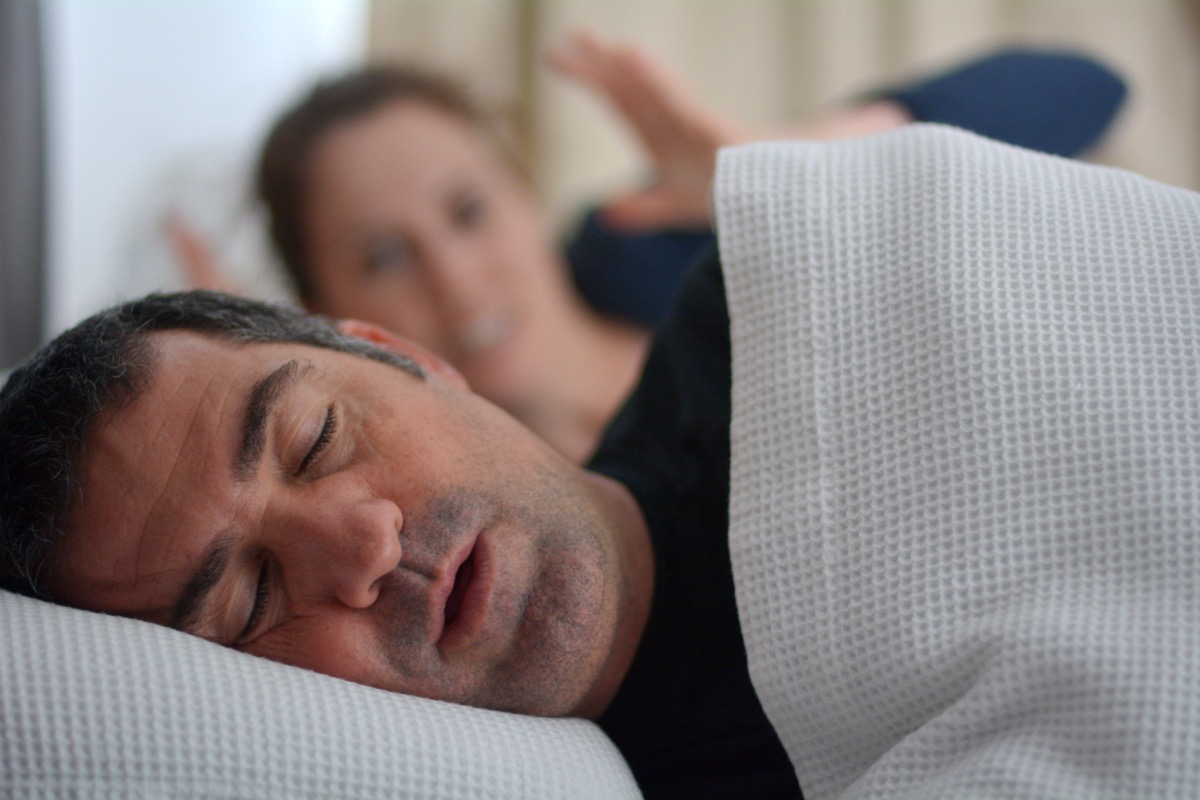 A person snoring in bed