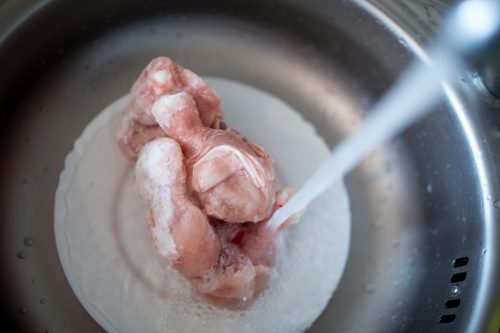 Thaw meat in water