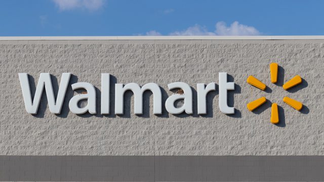 A Walmart sign on the wall of a store