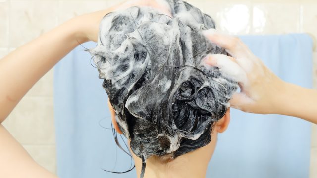 Woman,Washing,Her,Hair.