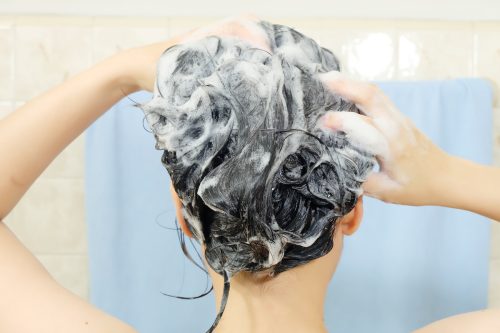 woman shampooing gray black hair | MercerOnline