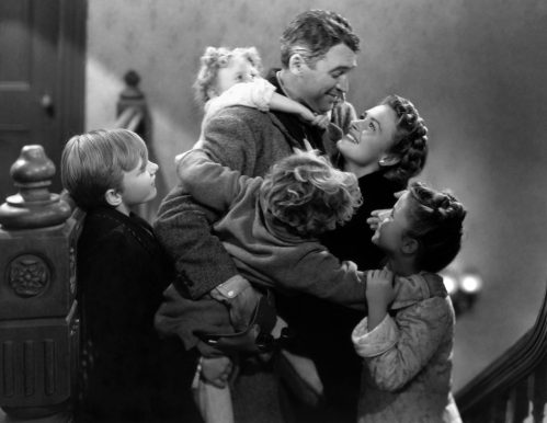 James Stewart, Donna Reed, Carol Coombs, Jimmy Hawkins, Larry Simms, and Karolyn Grimes in "It's a Wonderful Life"