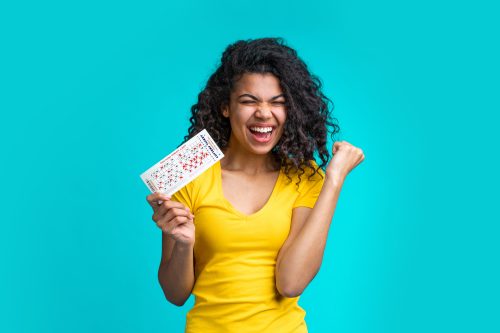 woman with a winning lottery ticket