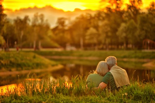 older couple watching the sunset