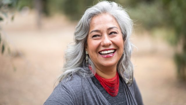 A beautiful gray-haired Mexican woman in nature