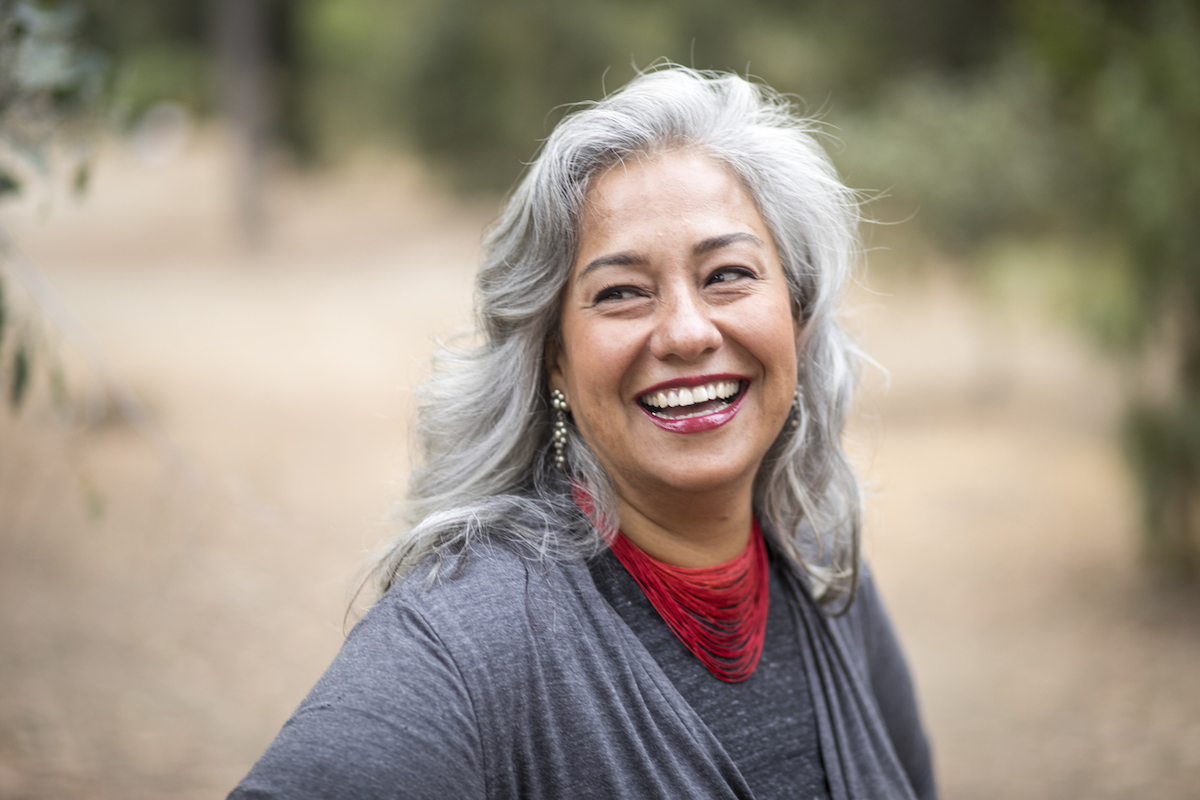 A beautiful gray-haired Mexican woman in nature