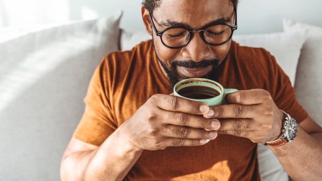 Man enjoying a cup of coffee.