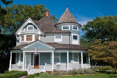 Beautiful gray traditional victorian house.