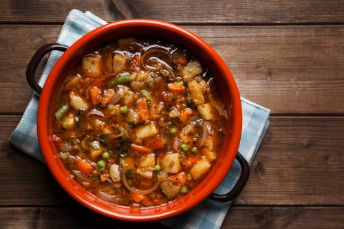Traditional Italian cuisine minestrone soup prepared on the pot