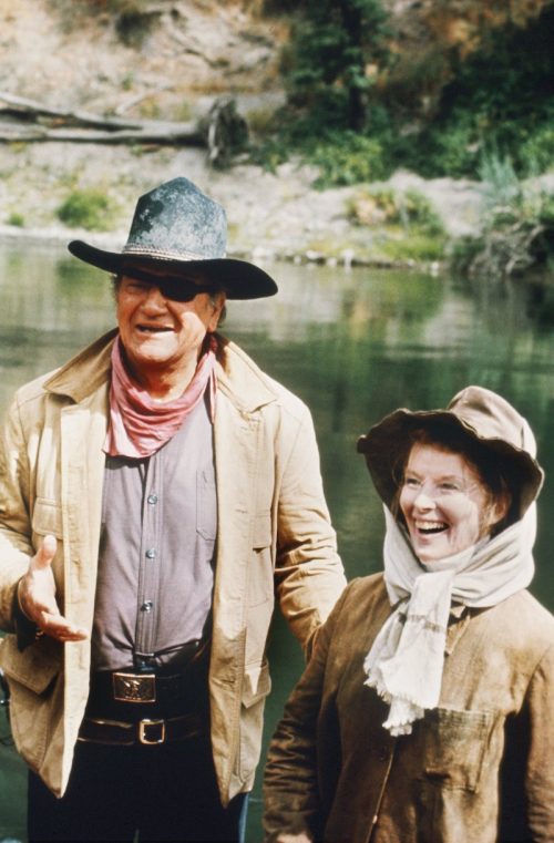 John Wayne and Katharine Hepburn on the set of "Rooster Cogburn"
