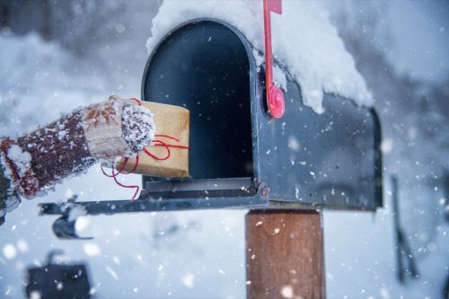 Child Receive a Present for Christmas in the Mailbox