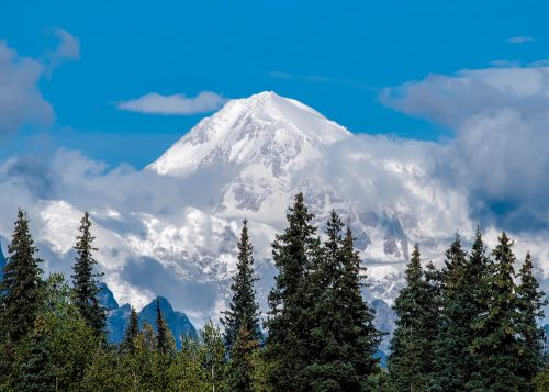Denali, or Mt. McKinley as many know it, isn't often visible because of clouds. When it does emerge, it's magnificent. This view is from Byers Lake, Alaska.