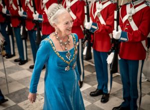 Queen Margrethe of Denmark reviews an honour guard as she arrives to the gala banquet at Christiansborg Palace