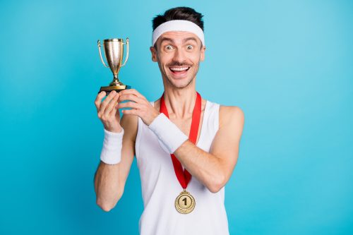 man holding a medal