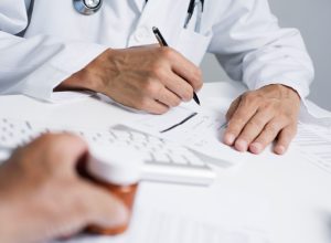 Doctor Writing Prescriptions