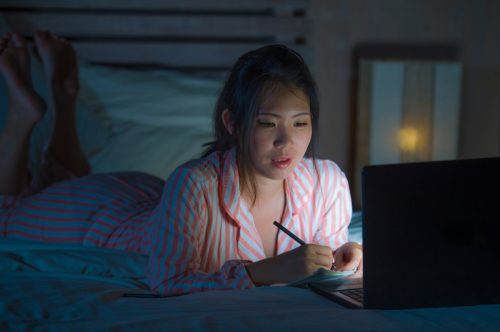 Young Woman Staying Up Late