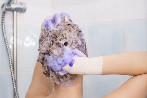 Woman Using Purple Shampoo