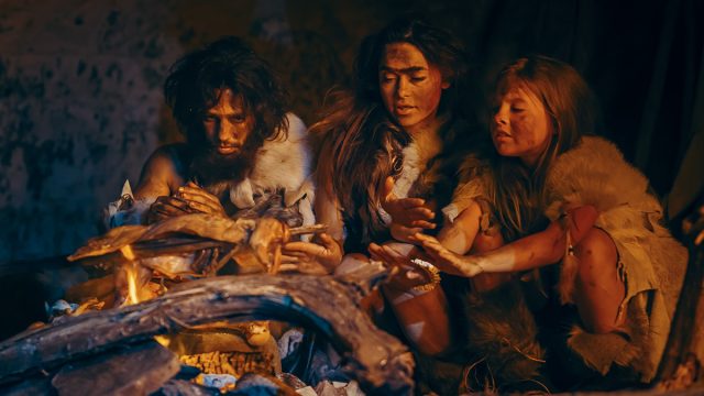 Neanderthal,Or,Homo,Sapiens,Family,Cooking,Animal,Meat,Over,Bonfire