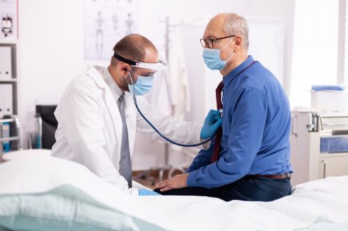 Man Getting Heart Checked By Doctor