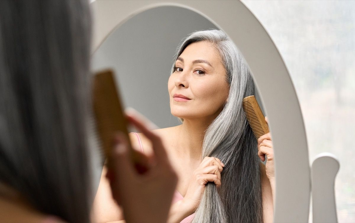 Older Woman Brushing Hair