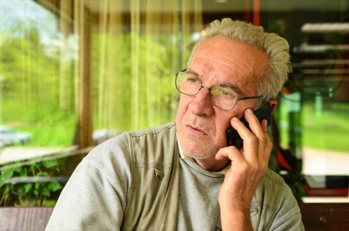 man making concerned phone call