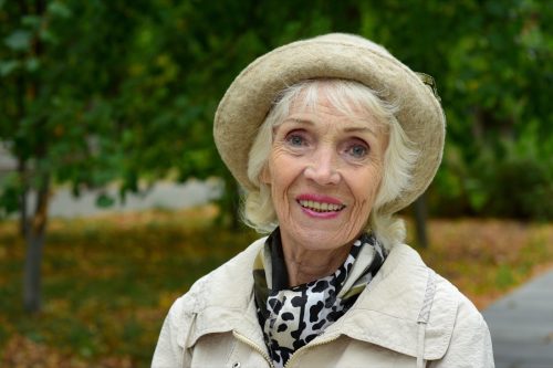 Older Woman With a Hat on Outside