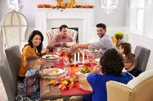 family enjoying thanksgiving dinner