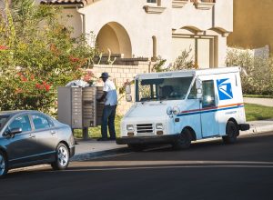 US postal worker delivering mail