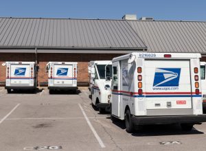 USPS Post Office Mail Trucks. The Post Office is responsible for providing mail delivery.