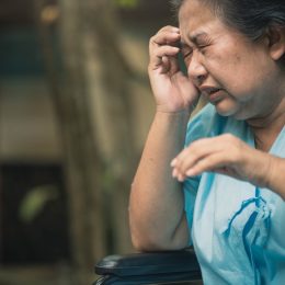 Asian elder woman suffer from stroke and powerful headache or brain attack.