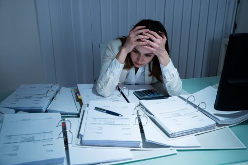 stressed woman at work late
