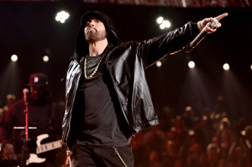 Eminem performing on stage at the Rock and Roll Hall of Fame induction ceremony in 2022.