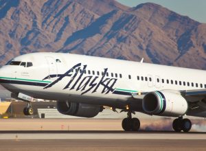 An Alaska Airlines plane landing at an airport