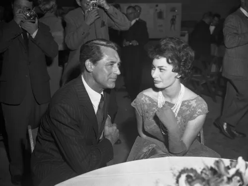Cary Grant and Sophia Loren at a cocktail party in 1957