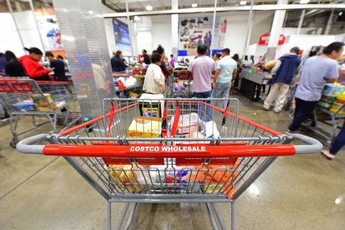 A close up of a shopping cart inside a Costco Warehouse Store