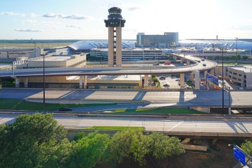 View of the control tower at Dallas Fort Worth International Airport (DFW), the largest hub for American Airlines (AA).