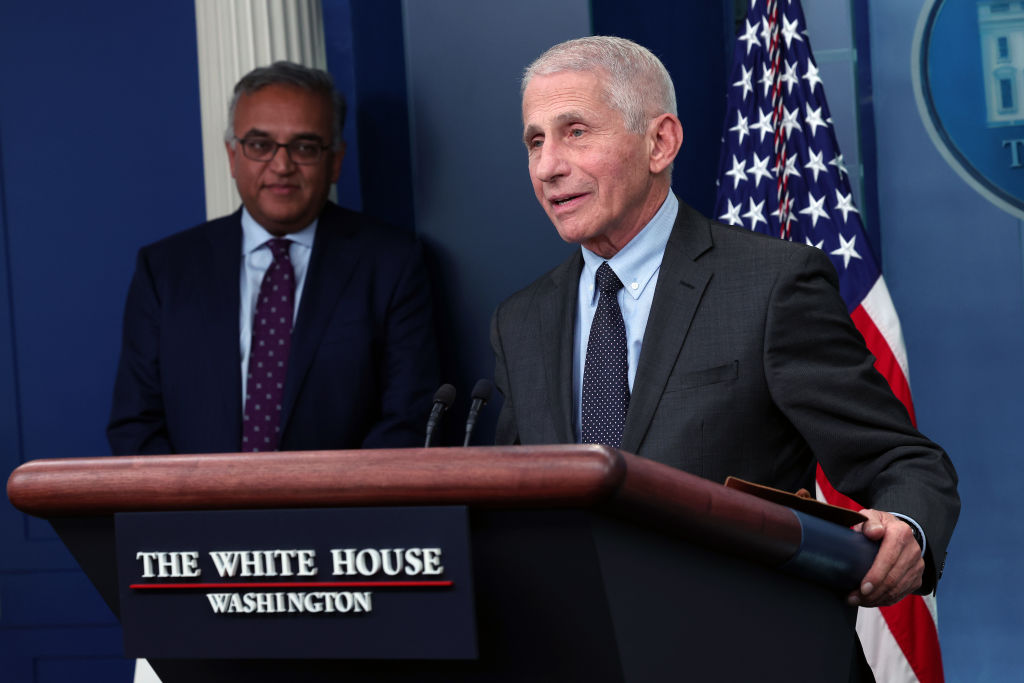 Dr. Anthony Fauci standing at a podium in the White House press room