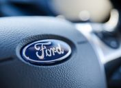 Closeup of the Ford logo insert on a steering wheel