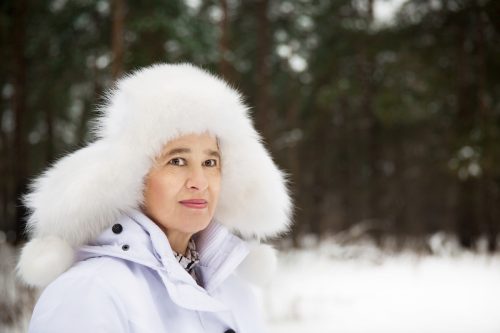Woman in white furry hat