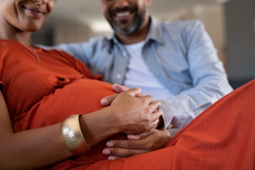 pregnant couple deciding on their baby girl's name