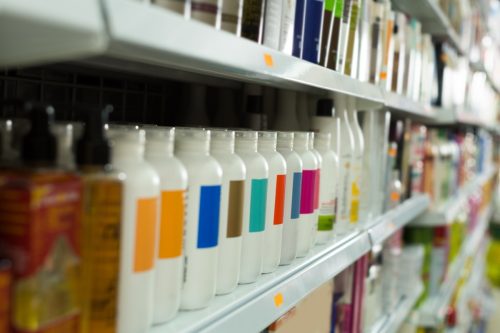 Shelves with different hair care products in salon