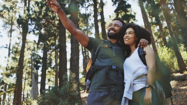 happy black couple hiking together