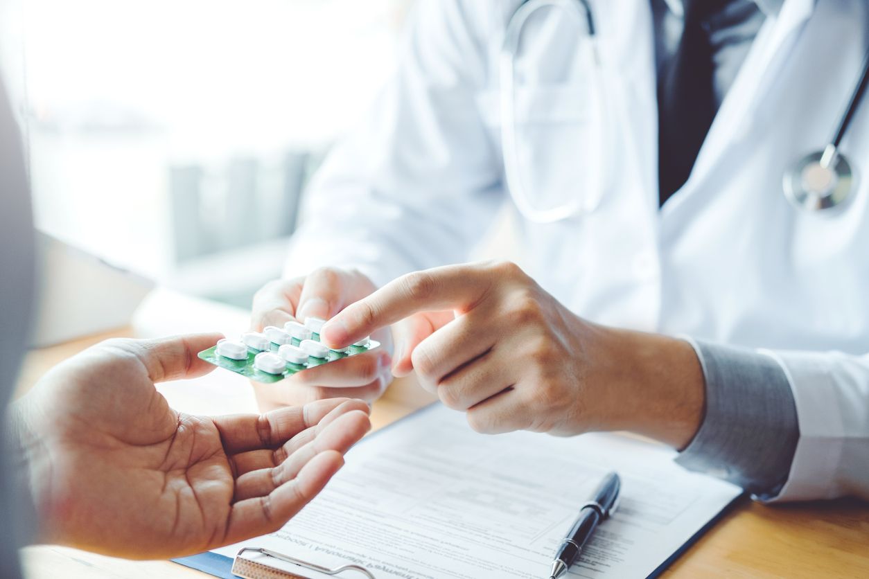 Doctor talking about medication to a patient.