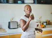 young black woman enjoying a smoothie